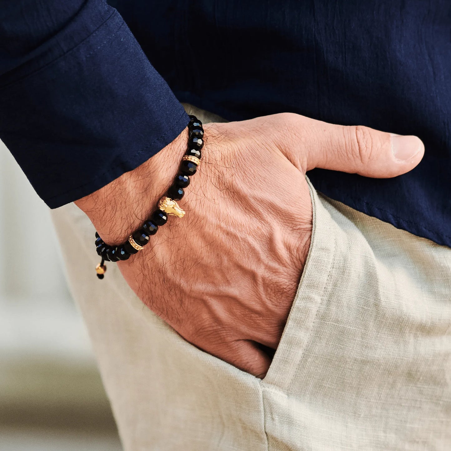 Man holding blue GT Collection leather card holder with multiple slots