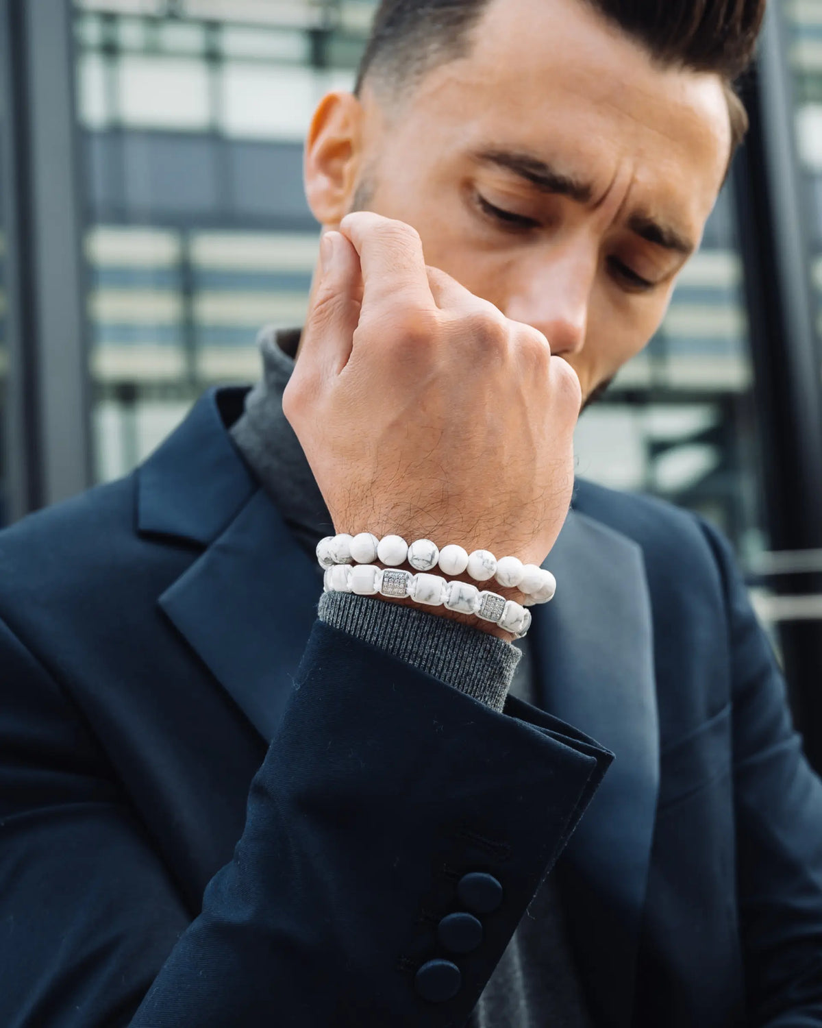 Howlite bead bracelet set on wrist, white beaded bracelets with silver-tone spacers