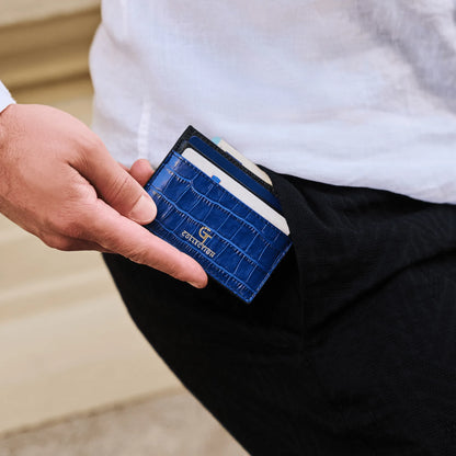 Man holding blue GT Collection leather card holder with multiple slots