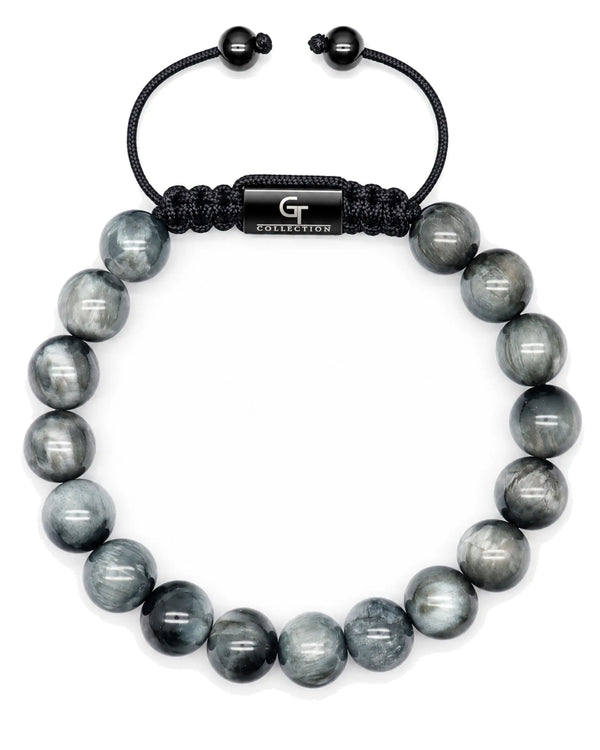 Single-row beaded bracelet with gray stone beads, black cord, engraved metal center tag