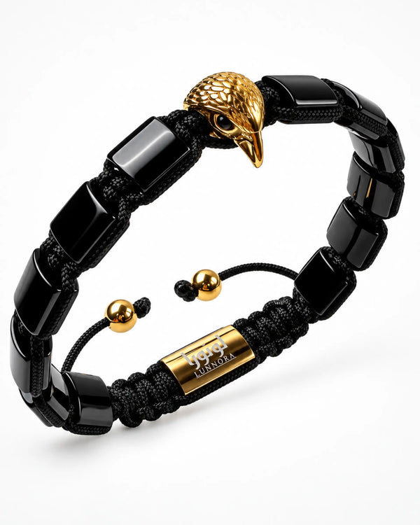 Black bead bracelet with gold falcon head charm and macrame-style cord details