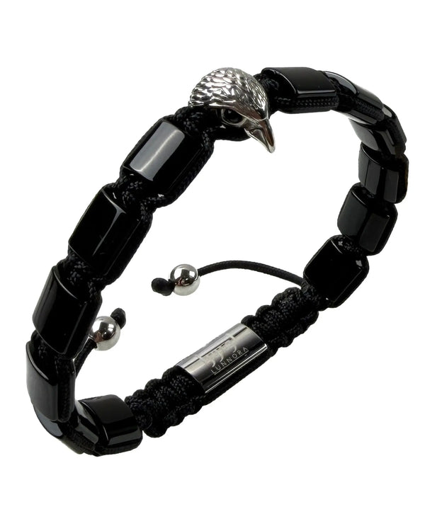 Black beaded bracelet with silver falcon head charm over black beads