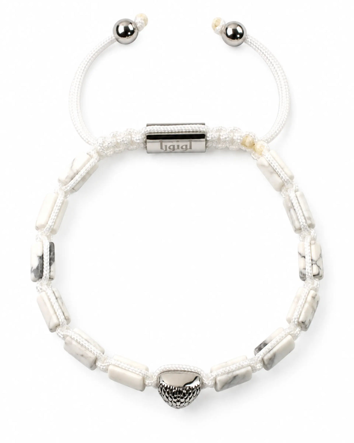 White howlite beaded bracelet with silver end caps and engraved center bar