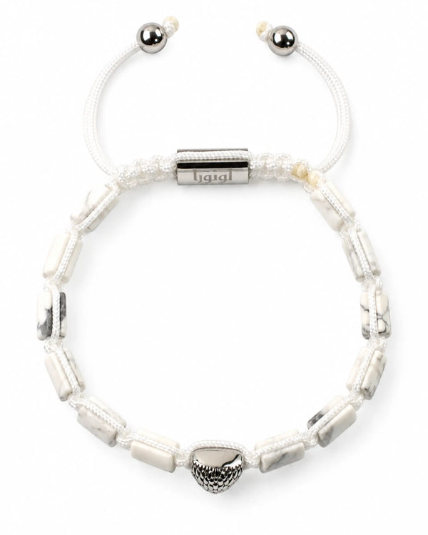White howlite beaded bracelet with silver end caps and engraved center bar