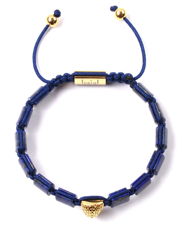 Lapis lazuli beaded bracelet with gold falcon-head charm and cord-adjusted ends