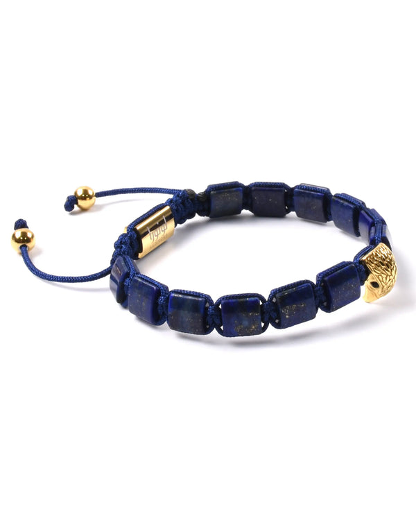 Lapis lazuli beaded bracelet with gold falcon charm and adjustable cord ties