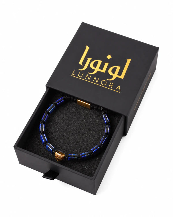 Blue lapis lazuli beaded bracelet displayed in a black jewelry gift box