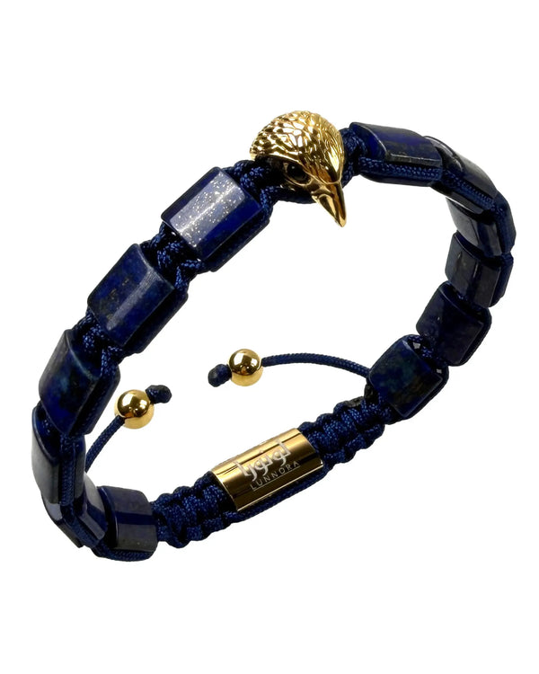Lapis lazuli beaded bracelet detail with gold falcon head clasp and gold tag
