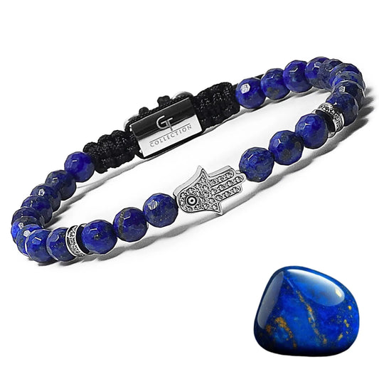 Men’s lapis lazuli bracelet with silver Hamsa hand charm on adjustable black braided cord.