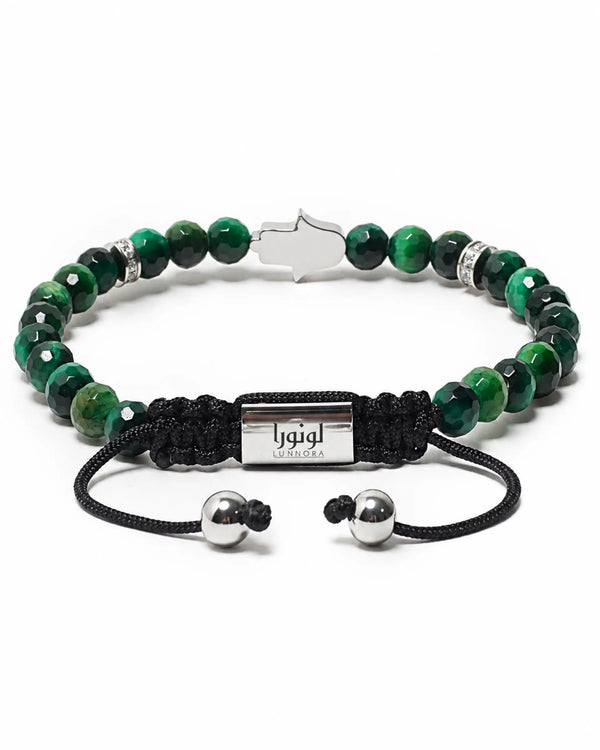 Green beaded bracelet with black cord strap and silver metal center plate