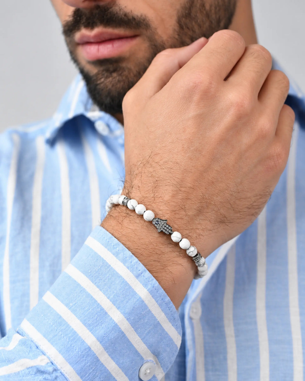 Howlite bead bracelet with silver clasp on wrist