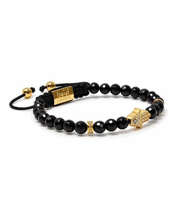 Black bead bracelet with gold hamsa charm and small gold spacers, black cord tie