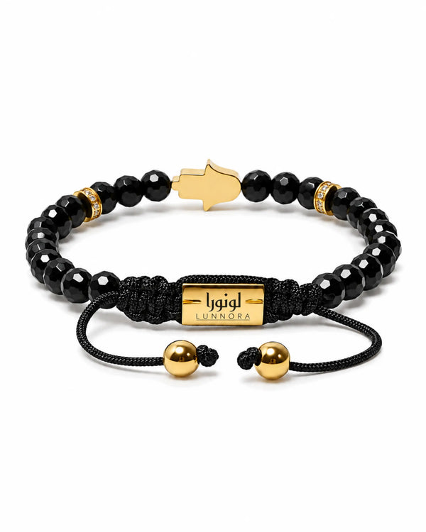 Black bead bracelet with gold star clasp and gold accents, black cord tie