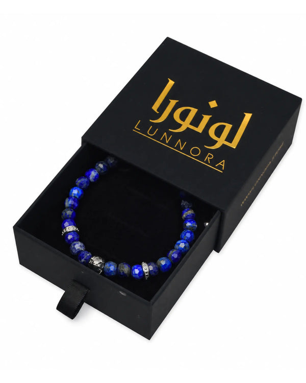Lapis lazuli bead bracelet shown in a black gift box