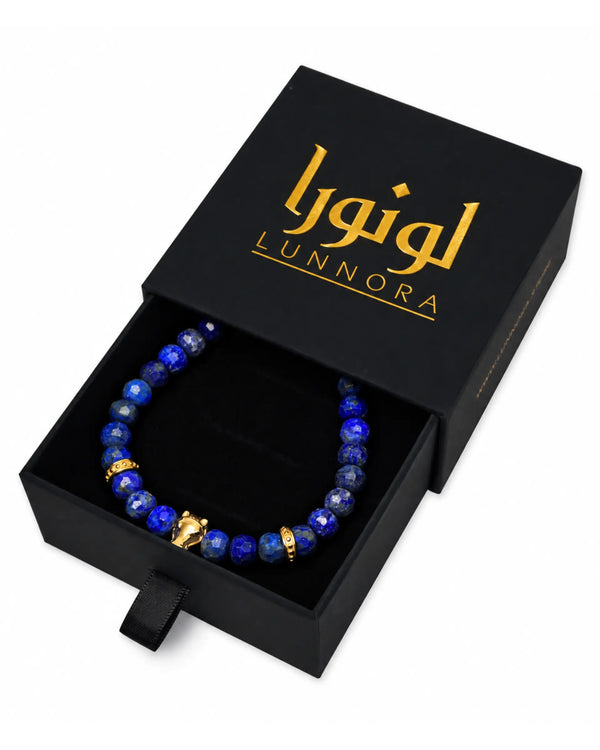 Lapis lazuli bead bracelet shown in black gift box with gold-tone accents