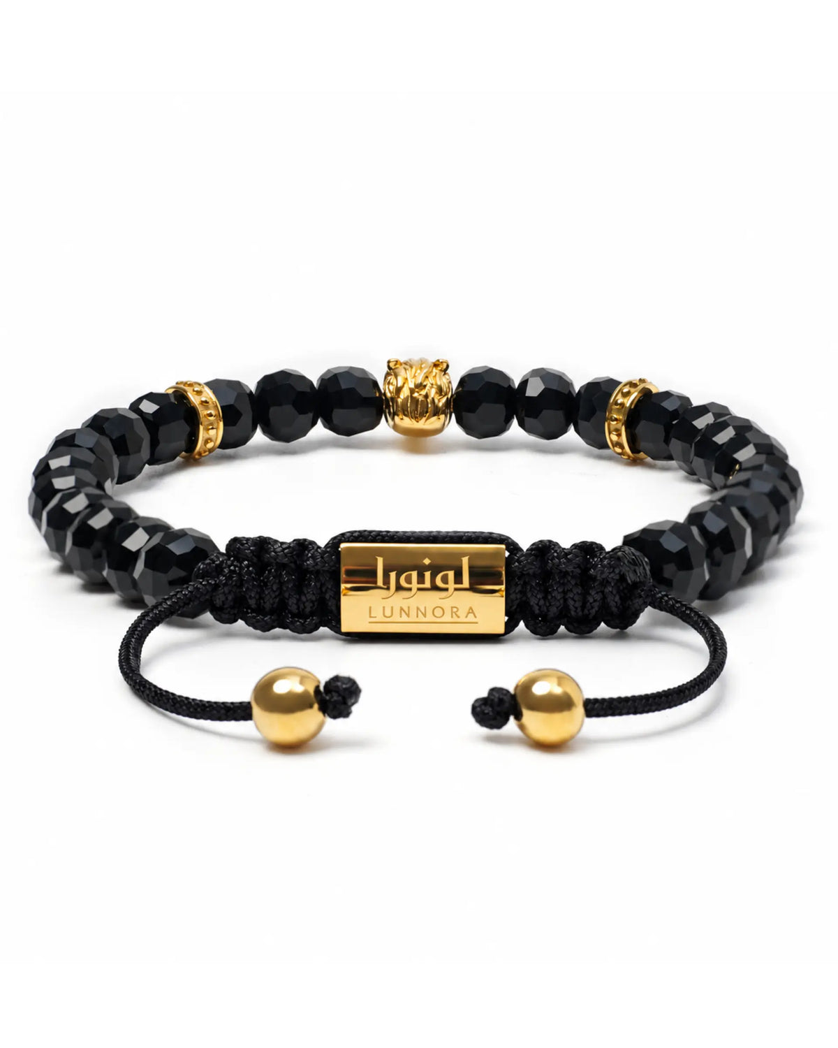 Black onyx beaded bracelet with gold-toned end caps and central horse charm on cord