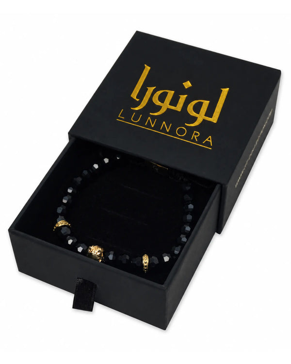 Black onyx bracelet in a black Lunnora gift box with gold-toned horse charm