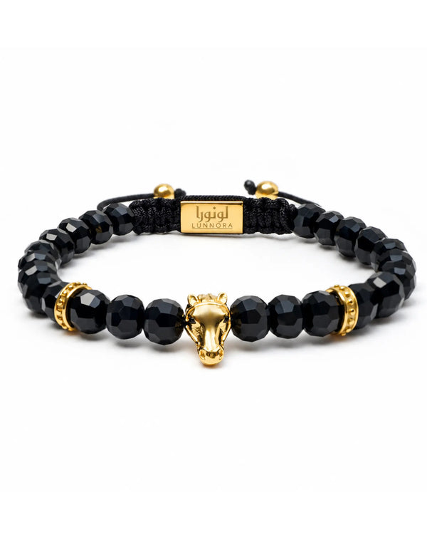 Black onyx beaded bracelet with gold-toned Arabian horse charm and adjustable cord