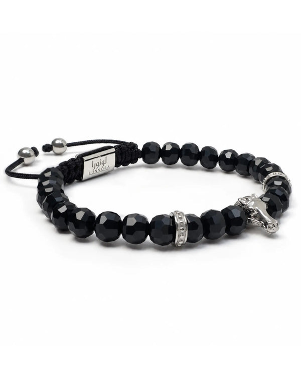 Black beaded bracelet with silver-tone horse head charm and silver-tone side accents