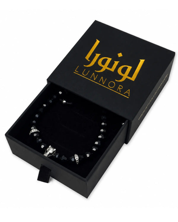 Black beaded bracelet with silver-tone horse charm shown in LUNNORA gift box