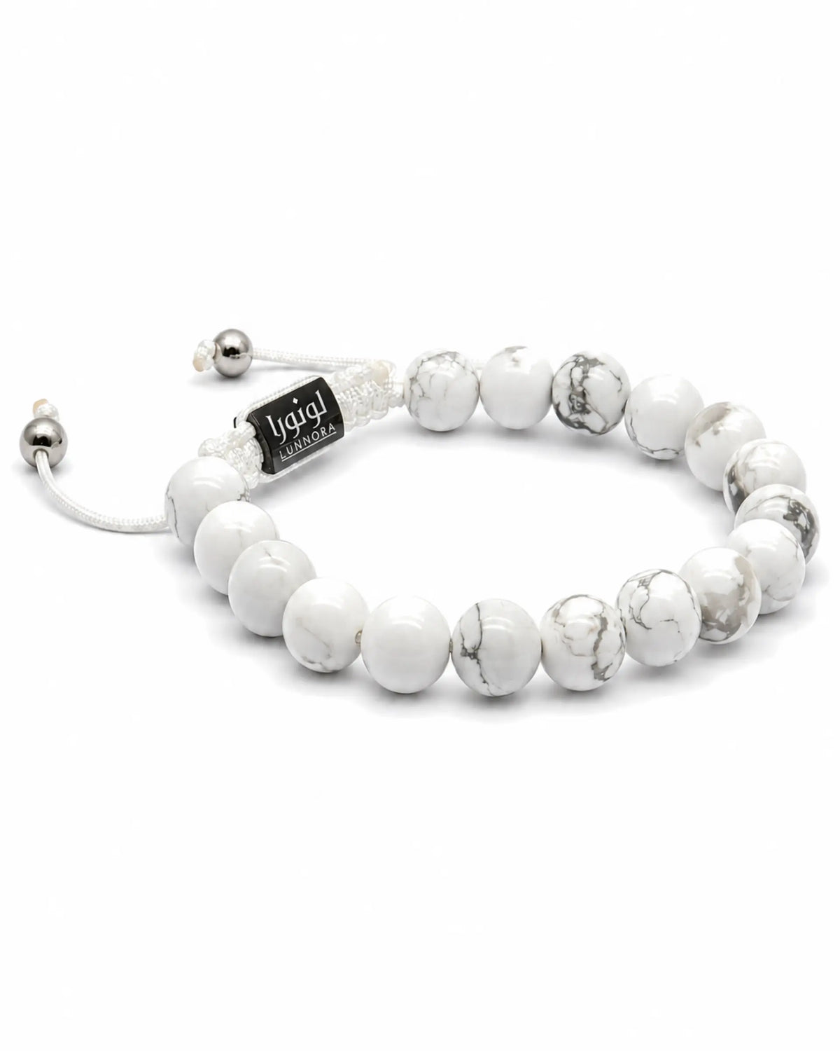 Howlite beaded bracelet with black engraved tag, white round beads and silver clasp