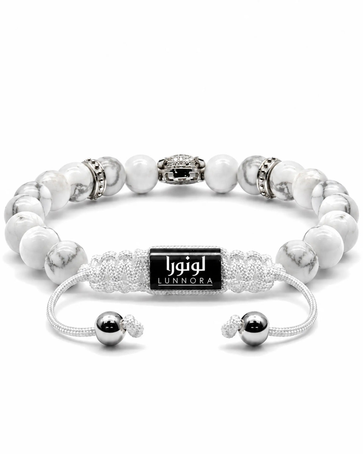 White howlite bead bracelet with black logo tag and silver-tone centerpiece