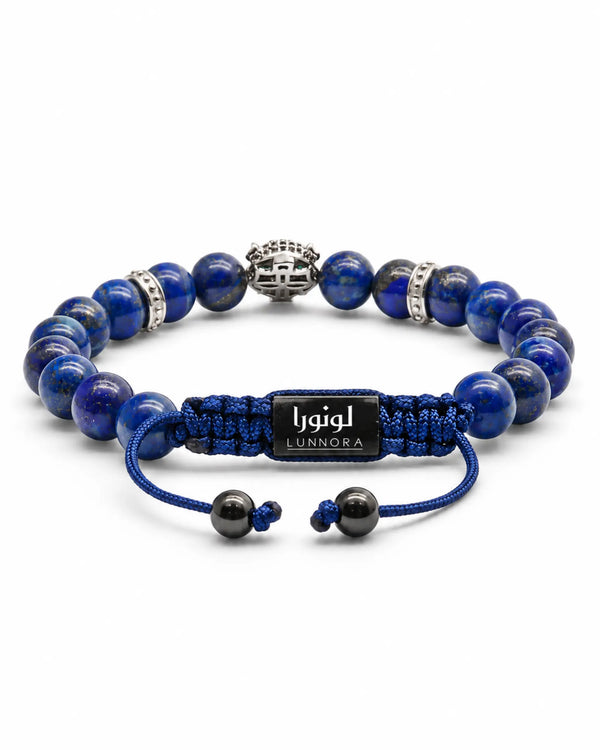 Lapis lazuli beaded bracelet with blue cord, black logo bar, and silver accents
