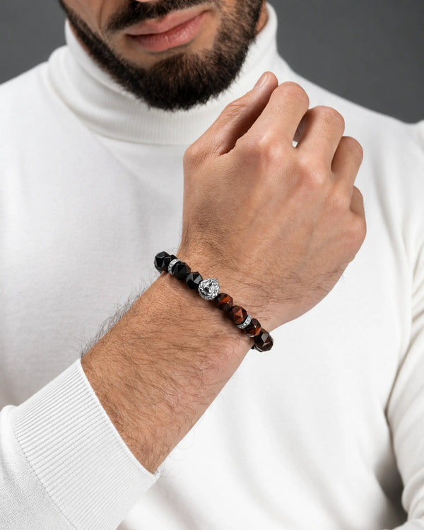 Beaded lion bracelet on wrist with black onyx-like beads and silver-tone accents