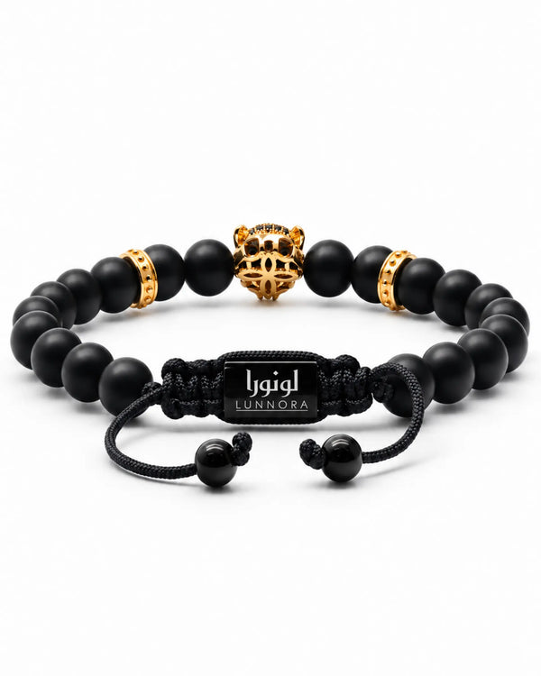 Black onyx bead bracelet with gold centerpiece and LUNNORA cord clasp