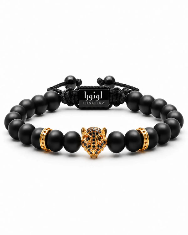 Black beaded bracelet set with gold leopard head centerpiece and gold barrel accents