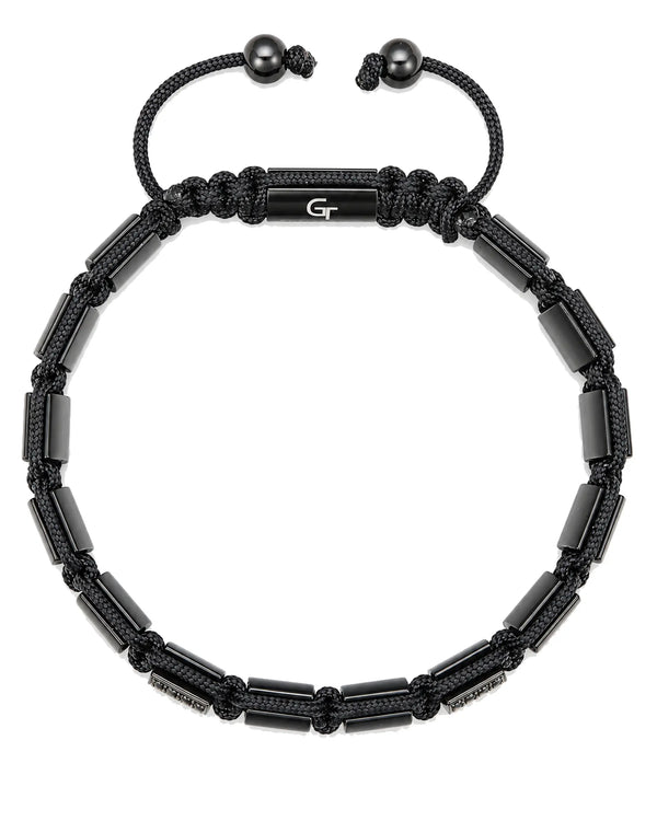 Black braided cord bracelet with faceted rectangular beads and round bead accents