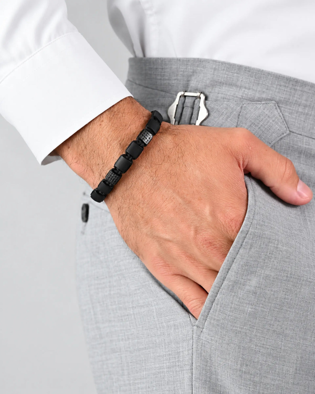 Black onyx flat bead bracelet on wrist with interlocking black bead segments
