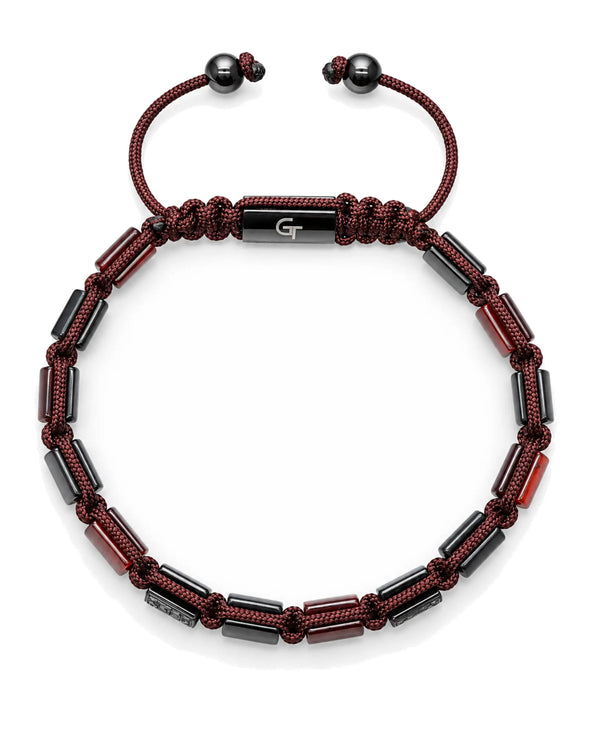 Beaded bracelet with dark red cord, black and maroon beads, and silver-toned center plate