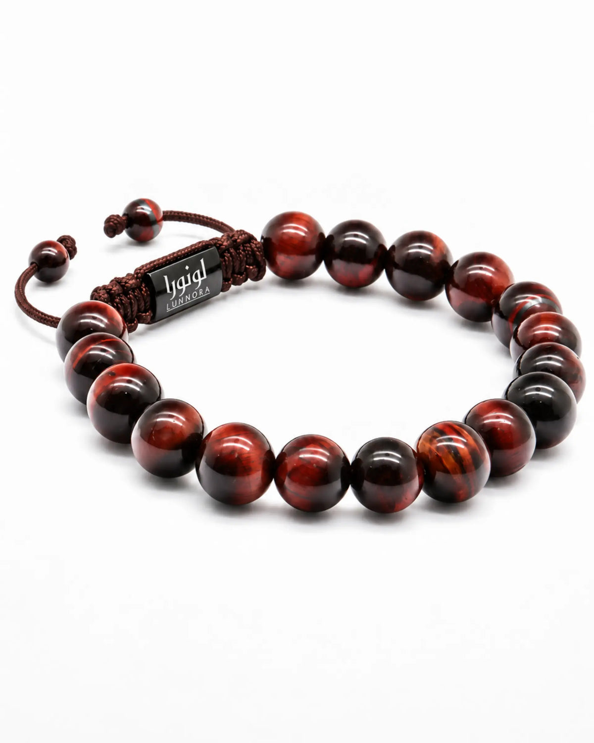 Tiger eye beaded bracelet with red and black round beads, braided cord, and metal tag