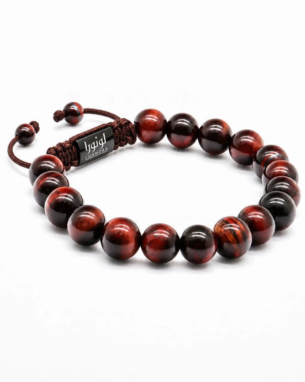 Tiger eye beaded bracelet with red and black round beads, braided cord, and metal tag