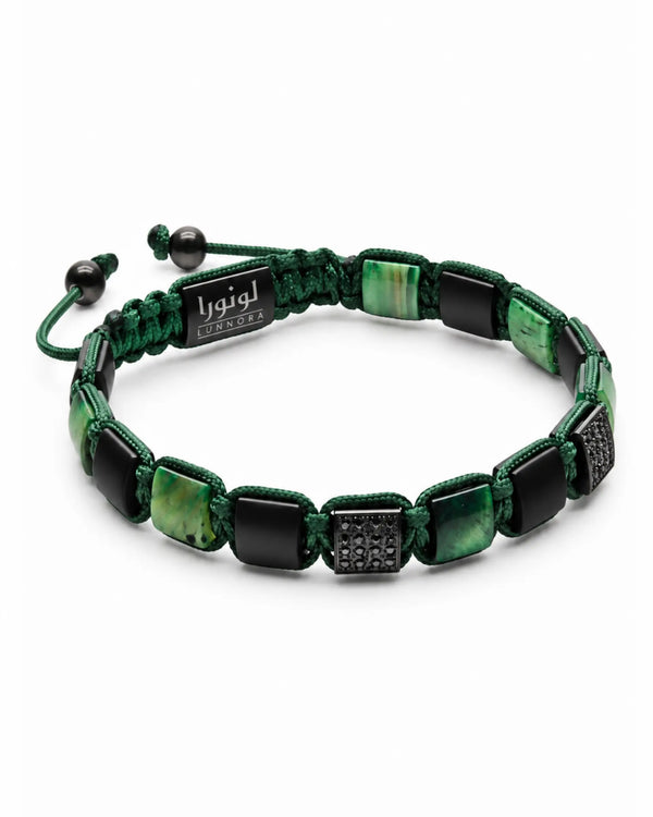 Green tiger eye and black bead bracelet with UNNORA label and oval stone segments
