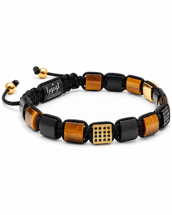 Black beaded bracelet with tiger-eye cube and gold-tone textured square centerpiece, logo tag