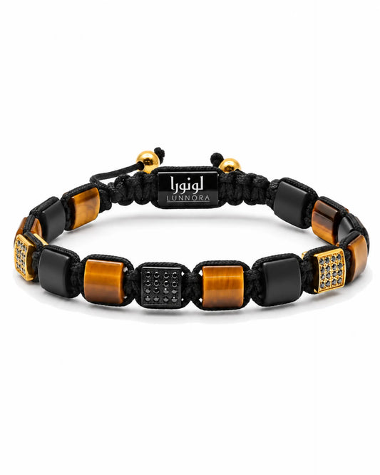 Black braided bracelet with tiger-eye stone cubes and gold-tone geometric accents, logo tag